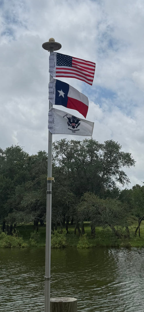 American, Texas and Coast Guard flags on a dock flagpole — Kelley N., Texas