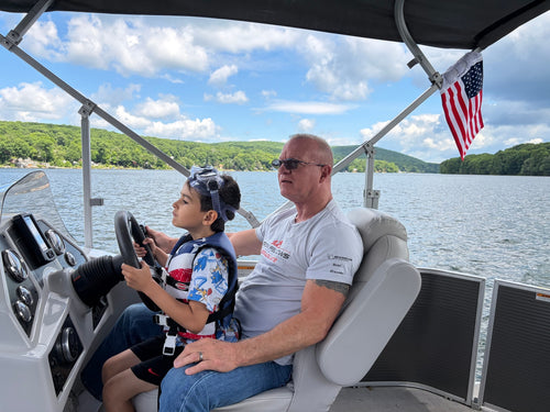 American flag on a boat canopy on a lake — Anne S., verified buyer